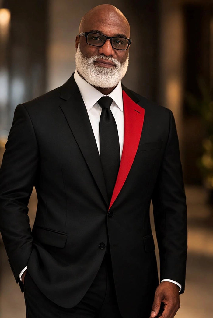 Fredrick Gunnison | Founder of 1OFF Creative Concepts in dark suit and bold red tie